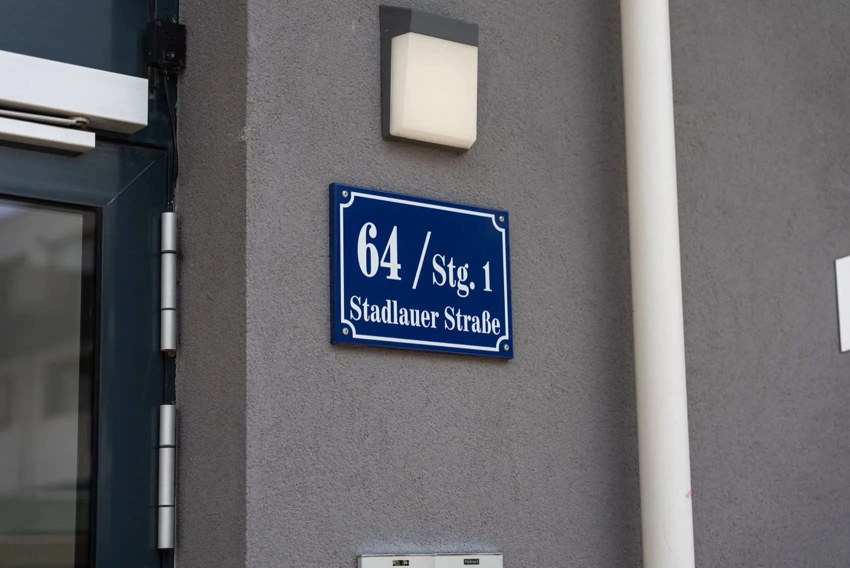 Address sign for Stadlauer Strasse 64 on the building